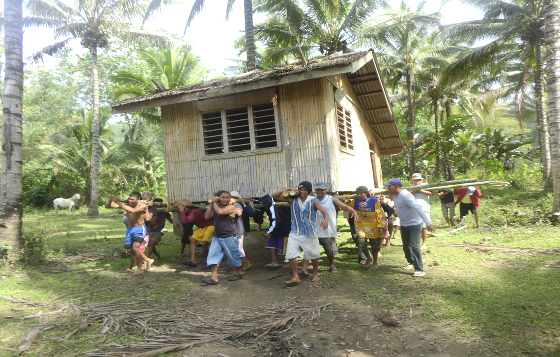 Community members helped move the house to its new location.